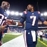 09/22/16: Foxborough, MA: A smiling Patriots quarterback Jacoby Brissett (7,right) is pictured as he leaves the field with teammate Devin McCourty (32, left) following New England's 27-0 victory over the Houston Texans. The New England Patriots hosted the Houston Texans in a Thursday night NFL regular season football game. (Globe Staff Photo/Jim Davis) section: sports topic: Patriots-Texans 