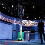 HEMPSTEAD, NEW YORK - SEPTEMBER 25: Workers make adjustments to the set for the first U.S. presidential debate at Hofstra University on September 25, 2016 in Hempstead, New York. Democratic presidential candidate Hillary Clinton is scheduled to debate Republican presidential candidate Donald Trump on Monday evening. (Photo by Drew Angerer/Getty Images