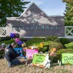 Chris Nelson of Burlington, Wash., took a photo Sunday at a memorial in the town dedicated to the victims of Friday?s shootings. Arcan Cetin (inset) is accused of killing five people.
