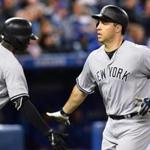 Yankees first baseman Mark Teixeira was congratulated at home plate by shortstop Didi Gregorius after hitting a game-tying homer in the ninth inning.