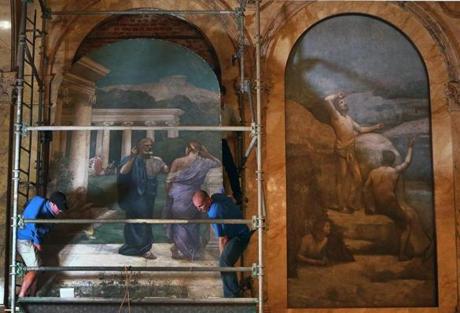 A team of six was needed to return the Pierre Puvis de Chavannes mural to its place on the the grand staircase of the Copley Square library.

