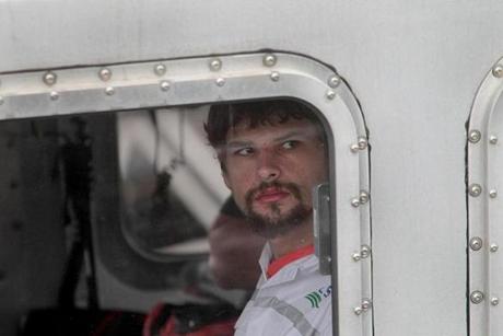 Nathan Carman is brought into the US Coast Guard base in Boston after his rescue at sea.  
