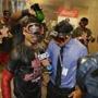 Boston Red Sox right fielder Mookie Betts, left, responds to questions during an interview as his team celebrates clinching the AL East title, following a baseball game against the New York Yankees on Wednesday, Sept. 28, 2016, in New York. (AP Photo/Frank Franklin II)