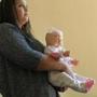 Lawrence, MA., 09/16/16, At the Massachusetts Society for the Prevention of Cruelty to Children RuthEmely Rivera, cq, uses a doll with a clear plasteic head to teach young mothers about Shaken Baby Syndrome. She is a home visitor for first time teen parents. Suzanne Kreiter\Globe staff 