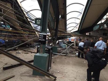 In a photo provided by William Sun, structural damage is seen at the train station in Hoboken, N.J., after a New Jersey Transit commuter train crashed into the station during the morning rush hour, Thursday, Sept. 29, 2016. The crash caused an unknown number of injuries and witnesses reported seeing one woman trapped under concrete and many people bleeding. (William Sun via AP)
