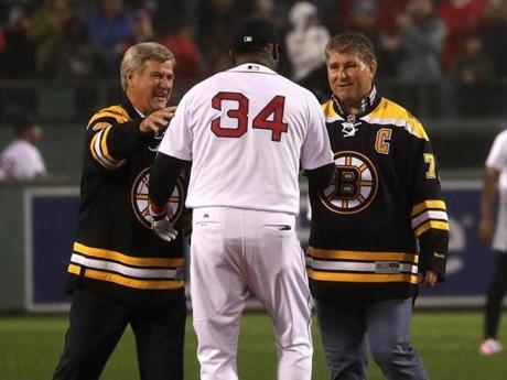 Legends Bobby Orr and Ray Bourque led a group of current Bruins to honor David Ortiz.
