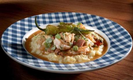 Lowcountry shrimp and grits with andouille sausage, bell pepper, and tasso ham gravy at Southern Kin Cookhouse.

