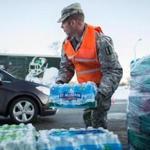 A member of the Michigan National Guard distributed bottled water earlier this year in Flint.