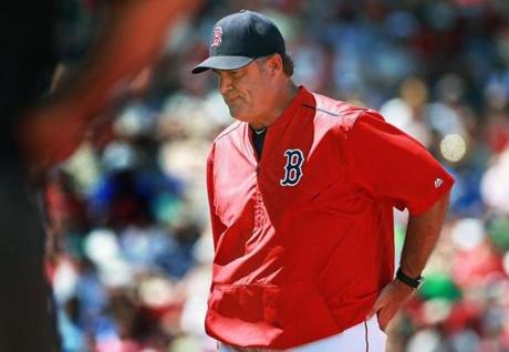 06/14/15: Boston, MA: Red Sox manager John Farrell is pictured as he heads back to the dugout after losing an argument with an umpire. The Boston Red Sox hosted the Toronto Blue Jays in a regular season MLB baseball game at Fenway Park. (Globe Staff Photo/Jim Davis) section:sports topic:Red Sox0Blue Jays
