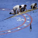 Workers install carpeting on the stage as preparations continue ahead of the second presidential debate at Washington University in St. Louis, Thursday, Oct. 6, 2016. The town hall debate between Republican presidential nominee Donald Trump and Democratic presidential nominee Hillary Clinton is set for this Sunday. (AP Photo/Jeff Roberson)