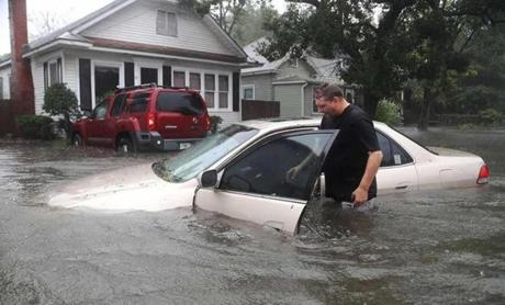 Rob Birch checked his car in St. Augustine, Fla., after it floated out of his driveway as Hurricane Matthew passed through. 

