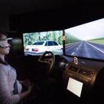 Yulan Liang, a research scientist for Liberty Mutual, demonstrated a self-driving automobile simulator in Hopkinton.
