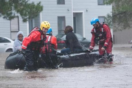 In this October 8, 2016 US Army National Guard handout photo, North Carolina emergency services evacuate residents of a neighborhood that fell victim to the flooding caused by Hurricane Matthew in Fayetteville, North Carolina. A weakened Hurricane Matthew made landfall Saturday in South Carolina, nearing the end of a four-day rampage that left a trail of death and destruction across the Caribbean and up the southeastern US coast, now swamped by record floods. / AFP PHOTO / US Amry National Guard / Staff Sgt. Jonathan SHAW / RESTRICTED TO EDITORIAL USE - MANDATORY CREDIT 