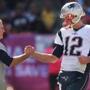 Tom Brady got a hand from Patriots coach Bill Belichick. 