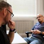 September 30, 2016 - Charlestown, MA Efrain Lozada (right) meets with Brian O'Neill to see how he's doing at Mass General Hospital in Charlestown, MA. Former drug addicts being hired as fulltime employees at Massachusetts General Hospital, one of first hospitals in the country to try this. Kieran Kesner for The Boston Globe. 