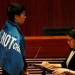 Sixtus Leung wore a banner that read ?Hong Kong is not China.? He and two other people must retake the oath.