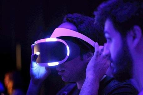 epa05572828 A visitor uses the new PlayStation VR 3D Virtual reality (VR) glasses during the Barcelona Games World Expo taking place at the Montjuic venue in Barcelona, northeastern Spain, 06 October 2016. The video game event, that brings together professionals and major industry agents to present new contents and experiences to the audience, will run from 06 to 09 October. EPA/MARTA PEREZ
