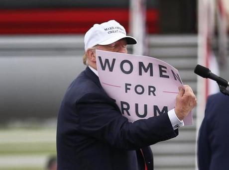 Republican presidential candidate Donald Trump held a ?Women for Trump? sign as he spoke during a campaign rally on Wednesday in Lakeland, Fla.
