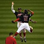 CLEVELAND, OH - OCTOBER 15: Francisco Lindor #12 and Rajai Davis #20 of the Cleveland Indians celebrate after defeating the Toronto Blue Jays with a score of 2 to 1 in game two of the American League Championship Series at Progressive Field on October 15, 2016 in Cleveland, Ohio. (Photo by Jason Miller/Getty Images)