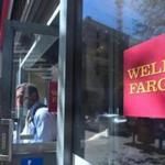 (FILES) This file photo taken on October 3, 2016 shows a man comes out of a branch of Wells Fargo bank in downtown Los Angeles in California. Large US banks reported lower third-quarter earnings on October 14, 2016 but beat analyst expectations, as Wells Fargo pledged anew to win back consumer trust after a bogus accounts scandal. Profits from JPMorgan Chase, Citigroup and Wells Fargo for the third quarter were lower compared with the year-ago period, revealing anew the drag on margins from ultra-low interest rates. / AFP PHOTO / FREDERIC J BROWNFREDERIC J BROWN/AFP/Getty Images