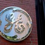 The GE logo at the front entrance of its Fort Point headquarters. 