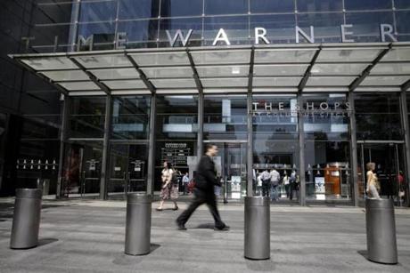 Pedestrians walked by an entrance to the Time Warner Center in New York in May.
