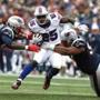 Foxborough, MA--10/2/2016-- Bills LeSean McCoy (C) is tackled by Pats Dont'a Hightower (L) and Alan Branch (R) during the first quarter of play at Gillette Stadium in Foxborough, MA, October 2, 2016. (Jessica Rinaldi/Globe Staff) (Jessica Rinaldi) Topic: Reporter: 