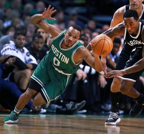 10/26/16: Boston, MA: The Celtics Avery Bradley loses control of the ball as he is pressured by the Nets Rondoe Hollis-Jefferson (right) in the first quarter The Boston Celtics hosted the Brooklyn Nets in the regular season NBA basketball opener at the TD Garden. (Globe Staff Photo/Jim Davis) section: sports topic: Celtics-Nets 
