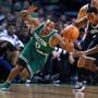 10/26/16: Boston, MA: The Celtics Avery Bradley loses control of the ball as he is pressured by the Nets Rondoe Hollis-Jefferson (right) in the first quarter The Boston Celtics hosted the Brooklyn Nets in the regular season NBA basketball opener at the TD Garden. (Globe Staff Photo/Jim Davis) section: sports topic: Celtics-Nets 