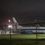 Mike Pence's campaign airplane sat partially on the tarmac and the grass after sliding off the runway while landing at LaGuardia. 