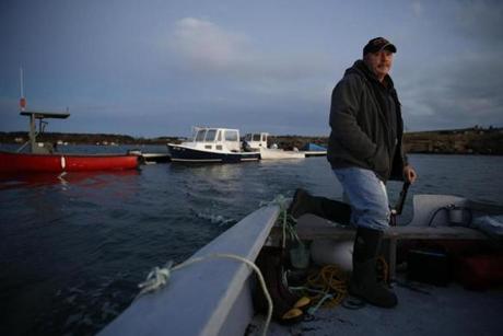 Captain George ?Butch? Harris, took a skiff out to his fishing boat in Eastport, Maine.
