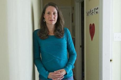 Lisa Newman poses for a photo inside her home in Northampton, Massachusetts on October 23, 2016. Newman is suing her former employer Smith College for alleged pregnancy discrimination. Matthew Healey for The Boston Globe (METRO - Reporter: Laura Krantz - Assigning Editor - John Blanding)
