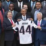 US President Barack Obama poses with Patriots coach Bill Belichick (L) and owner Robert Kraft (R) during an event honoring Super Bowl champion, the New England Patriots, on April 23, 2015 on the South Lawn of the White House in Washington, DC. AFP PHOTO/MANDEL NGANMANDEL NGAN/AFP/Getty Images