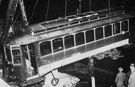 The trolley car was lifted out of the channel at 3:30 a.m. Nov. 8, about 10 hours after the crash.
