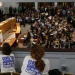  Charter school supporters leaned over a balcony and watched as Governor Charlie Baker gave testimony at a State House hearing last year.