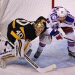 Rangers forward Michael Grabner crowded Bruins goalie Tuukka Rask in the first period.