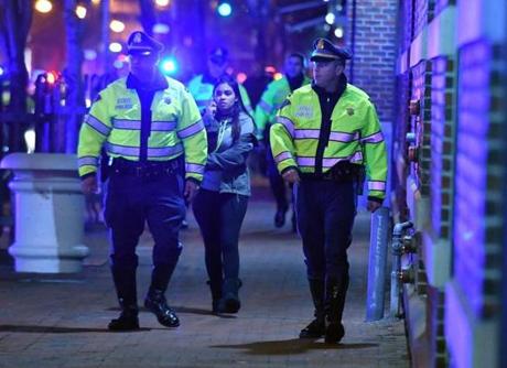 Police and pedestrians outside the Galleria Mall in Cambridge following after police disbursed a crowd of more than 1000 A crowd gathered for an event featuring Boston Celtics player Jaylen Brown and rapper Desiigner. Josh Reynolds for The Boston Globe (Metro ) 
