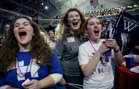 Wellesley, MA - November 08, 2016: Wellesley College sophomores (left to right) Emma Gellman, Netanya Perluss and Aviva Feldman enjoy the election results in Hillary Clinton's favor during an Election Night watch party at the Dorothy Town Field House at Wellesley College in Wellesley on November 08, 2016. Students, alums, and women of all ages gathered at Hillary Clinton's alma mater to await election results. (Craig F. Walker/The Boston Globe) Section: Metro reporter:
