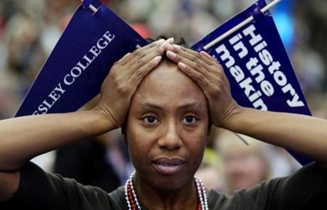 Wellesley, MA - November 08, 2016: Wellesley College alum (1993) Maria Manning holds her head while watching election results during an Election Night watch party at the Dorothy Town Field House at Wellesley College in Wellesley on November 08, 2016. The had just called Michigan and she said she was examining the path to the presidency in her head. Students, alums, and women of all ages gathered at Hillary Clinton's alma mater to await election results. (Craig F. Walker/The Boston Globe) Section: Metro reporter:
