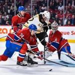 Bruins forward David Backes tried to squeeze between Canadiens defenseman Alexei Emelin (74) and goalie Carey Price. 