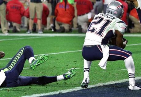 Glendale, AZ - 2-1-15 - Super Bowl XLIX - NE Patriots - Seattle Seahawks - Patriot DB Malcolm Butler intercepts a Russell Wilson pass intended for Seattle Seahawks wide receiver Ricardo Lockette at the end of the 4th quarter. (Barry Chin / Globe staff) Glendale , AZ - 02/01/15 - The New England Patriots take on the Seattle Seahawks in Super Bowl XLIX at University of Phoenix Stadium in Glendale, AZ. (Barry Chin/Globe Staff), Section: Sports, Reporter: Shalise Manza Young, Topic: 02Patriots-Seahawks Super Bowl, LOID: 8.0.2154333569. sportsessay 

