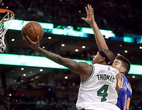 Boston MA 11/06/16 Boston Celtics Isaiah Thomas makes a driving layup beating New York Knicks Willy Hernangomez during second quarter action at the TD Garden. (Photo by Matthew J. Lee/Globe staff) topic: reporter: 
