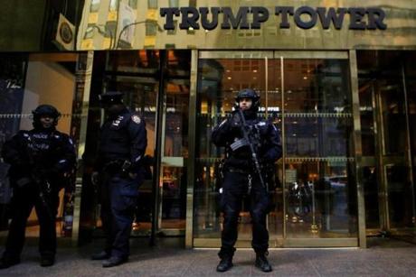 U.S. secret service agents stand guard outside Republican president-elect Donald Trump's Trump Tower in New York Saturday.

