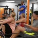 13zowinterfitness - Woburn, MA: 10/27/16 Personal trainer Dan Newton of Unleashed Fitness watches as a circuit class uses rowing machines. (Mary Schwalm for The Boston Globe)