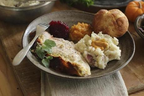 FILE - This Sept. 28, 2015, file photo shows Italian-style roast turkey breast in Concord, N.H. If you're not feeding a crowd for the holidays, then roasting a turkey breast could be the way to go. This dish is from a recipe by Sara Moulton. (AP Photo/Matthew Mead, File)
