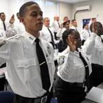 BOSTON, MA - 11/16/2016: Cadet Jose Correia ( far left ) with other cadets takes the oath at the Boston Police Academy where Mayor Martin J. Walsh and Boston Police Commissioner William B. Evans attended a swearing in of Boston Police Cadets to the Boston Police Department. (David L Ryan/Globe Staff Photo) SECTION: METRO TOPIC 17cadet