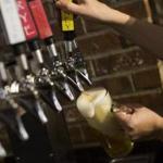 Federal regulators have struck a record-high settlement from a Massachusetts beer distributor.