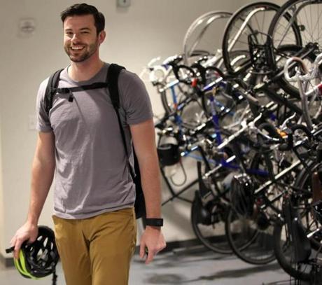 Cambridge Ma 10-19-2016 Kayak Employee Stephen Mueller (cq) arrives at work in Cambridge after a short commute. He is inside bike storage area. He is photographed for TPTW Boston Globe Magazine Edition. Boston Globe Staff/Photographer Jonathan Wiggs
