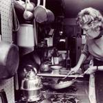 Julia Child preparing scallops in her Cambridge kitchen in 1975.