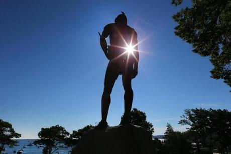 Plymouth-08/27/15 -The morning sun shines through the statue of Wampanoag Indian chief Massasoit which stands atop a hill overlooking Plymouth Rock. Boston Globe staff photo by John Tlumacki(metro)
